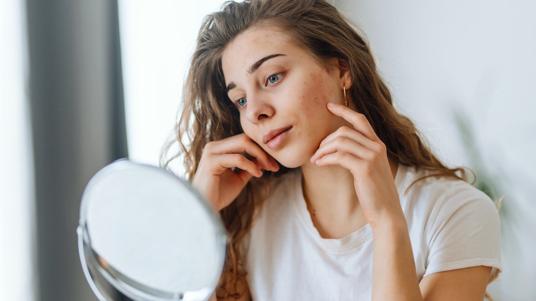 Woman looking at her face shape