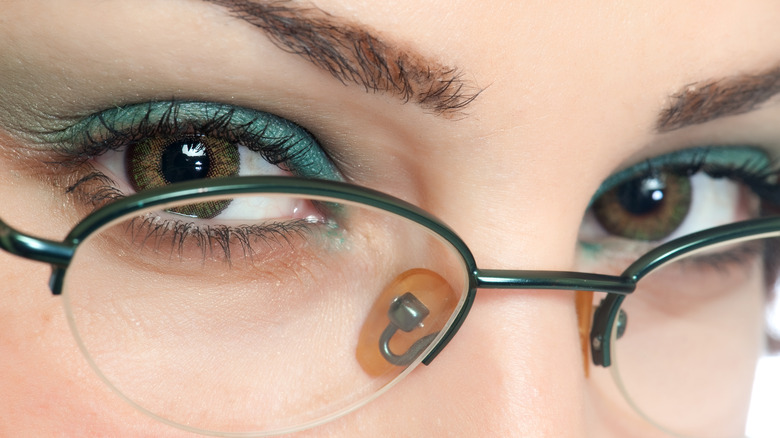 Woman in round, semi-rimless glasses