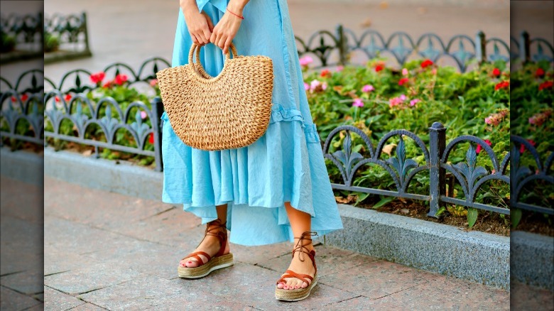 Blue dress and woven purse