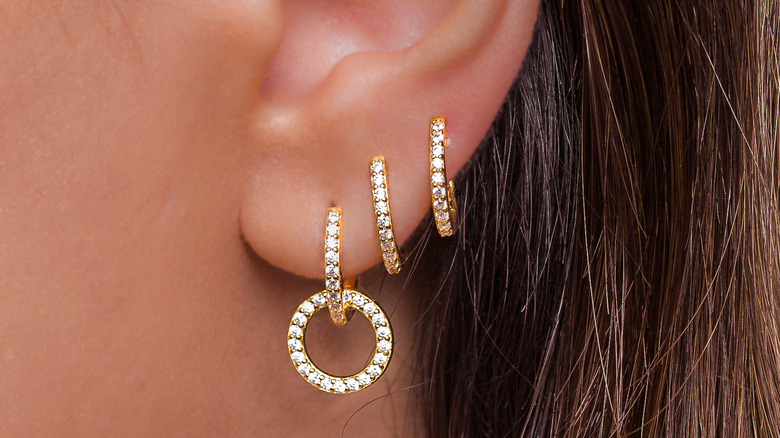 ear with gold diamond hoops