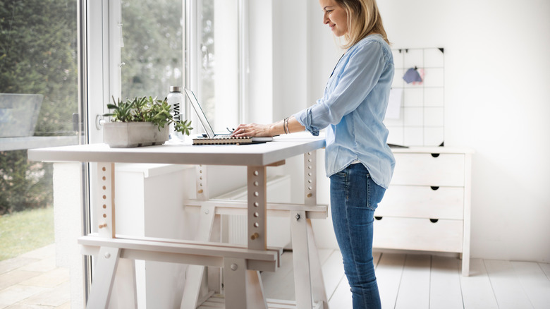 Woman using standing desk