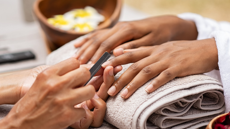 woman getting her nails done 