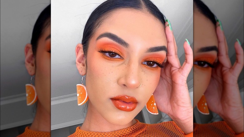 A woman with orange makeup