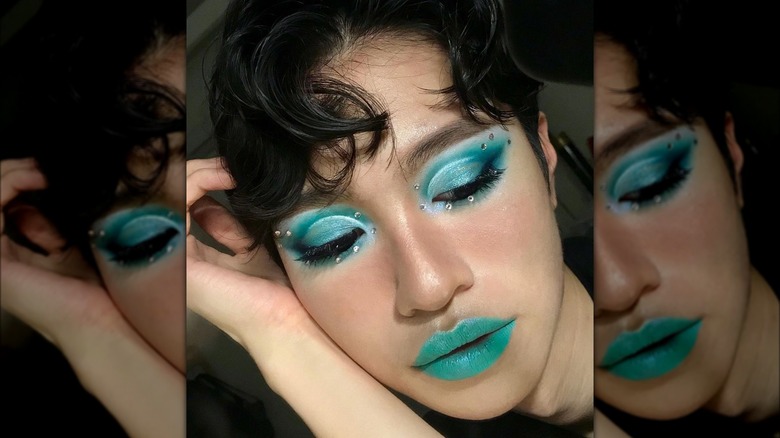 A person with blue makeup