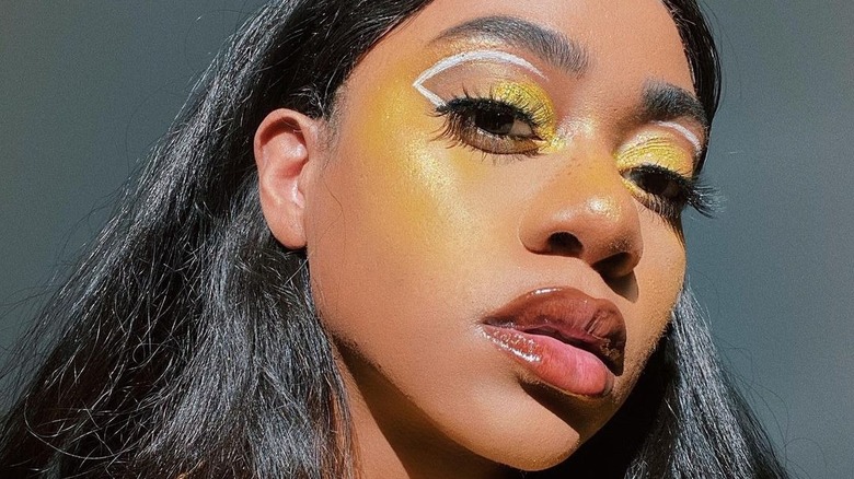A woman with yellow makeup
