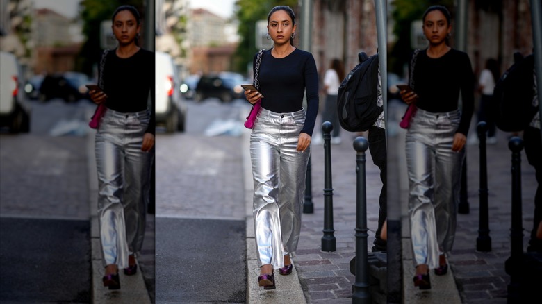 woman wearing silver pants