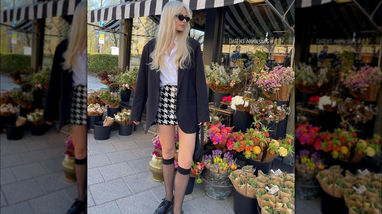 woman wearing houndstooth pattern skirt with blazer