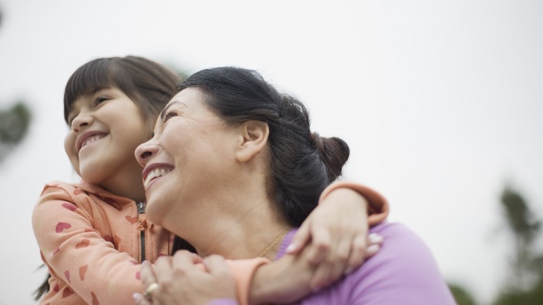 Mother and daughter smiling 