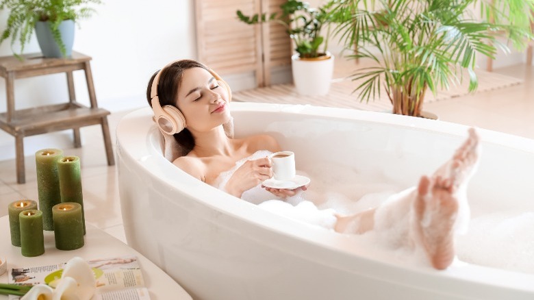 Woman relaxing in bubble bath