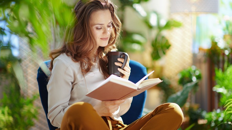 Woman enjoying a book, coffee