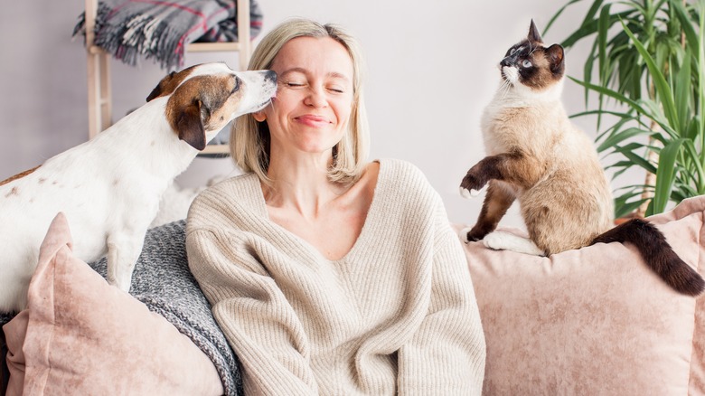 Woman with dog and cat