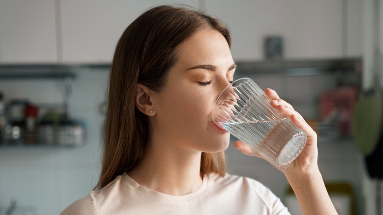 Woman drinking glass of water