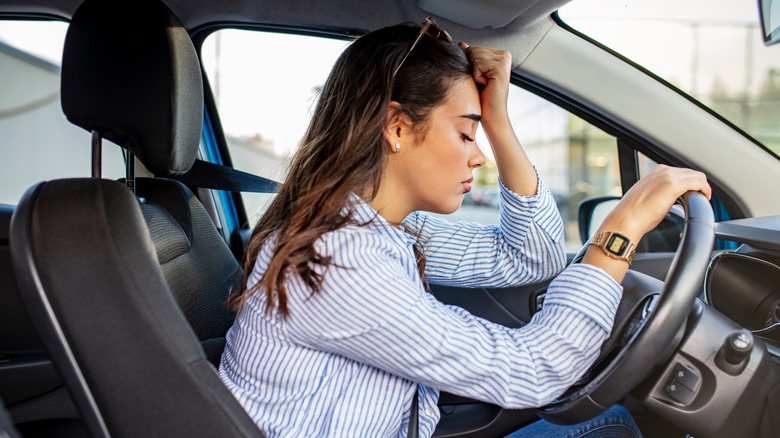 tired woman driving