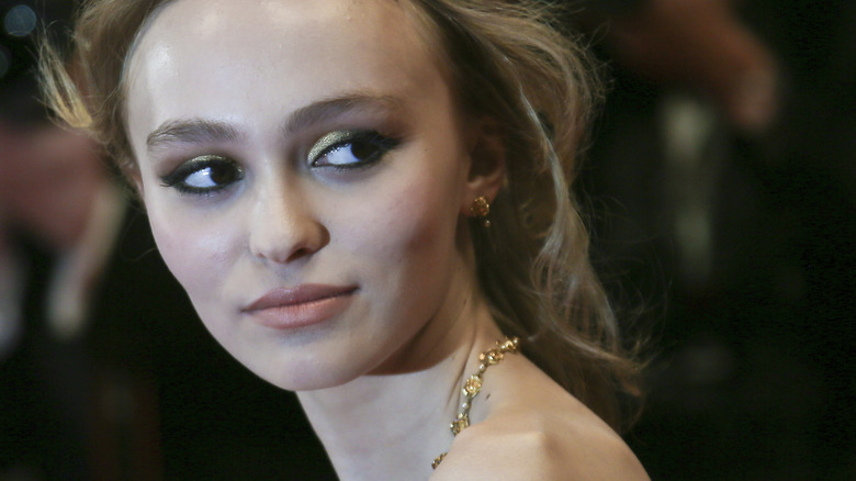 Lily-Rose Depp wearing smokey eye and gold eyeshadow