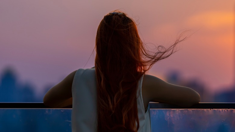 woman watching sunset