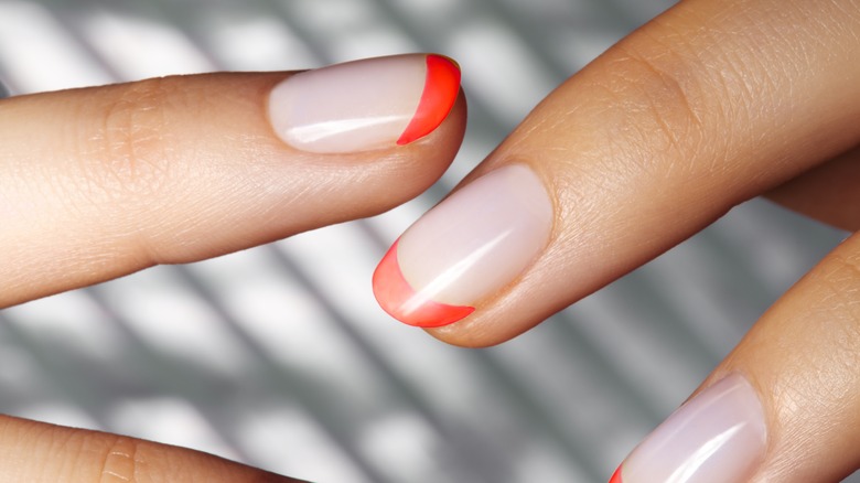 Short nails with orange tips