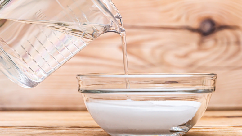 Solution being poured into bowl 