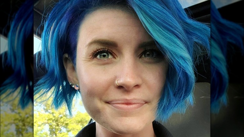Woman with blue wedge hair