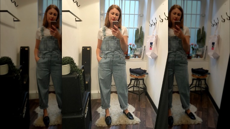 woman in baggy overalls