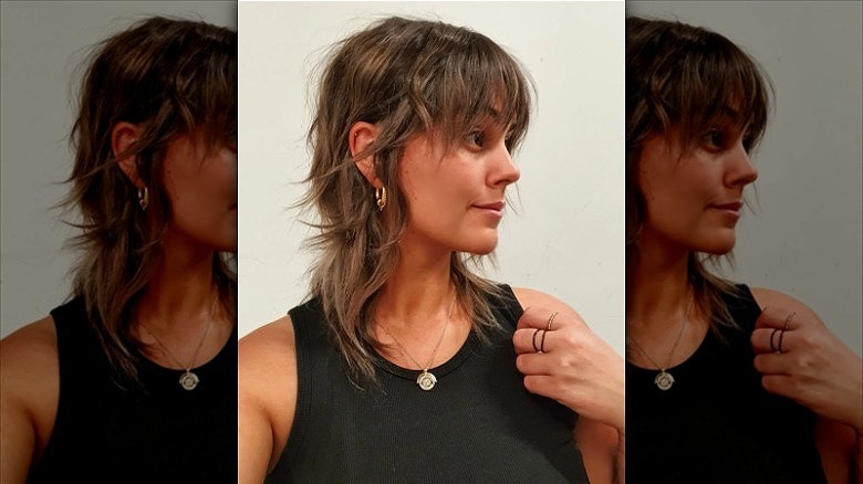 woman with wolf cut curtain bangs