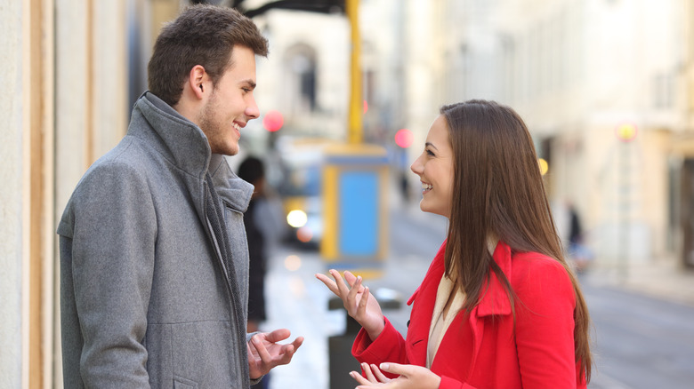 Couple smiling at each other, first date