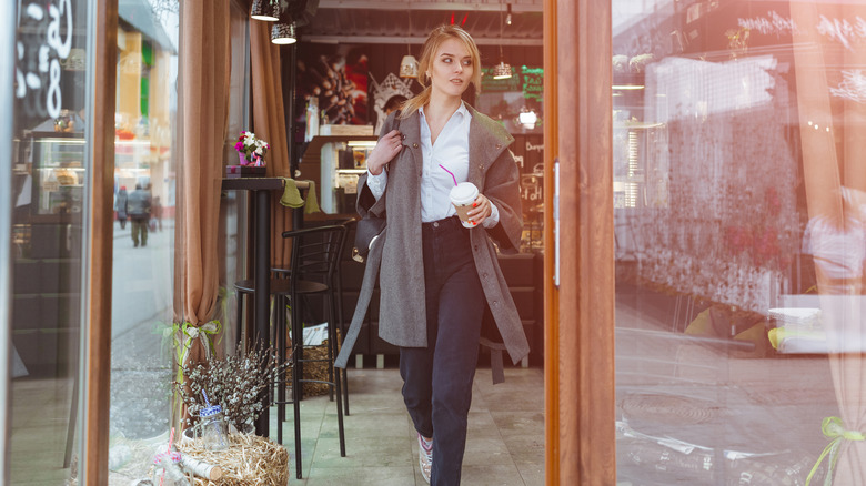 Woman leaving a cafe