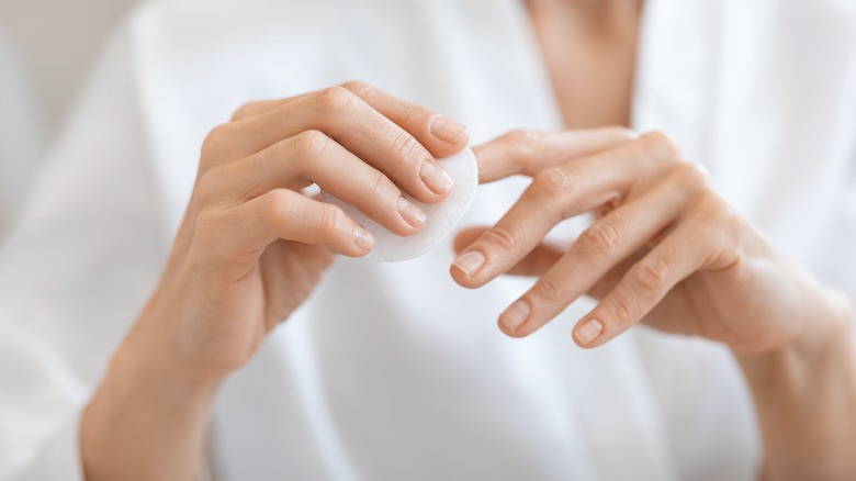 women removing nail polish