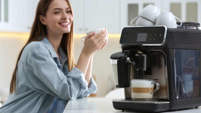 Woman enjoys homemade latte 