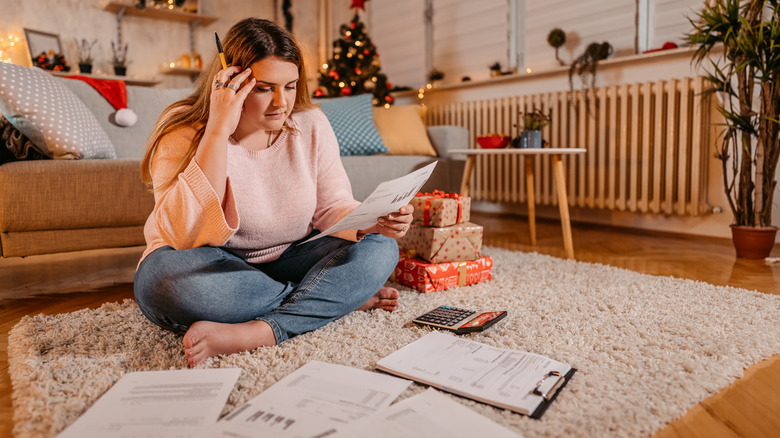 woman stressed by holiday spending