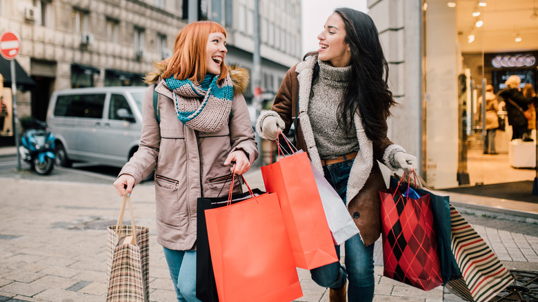 smiling women shopping