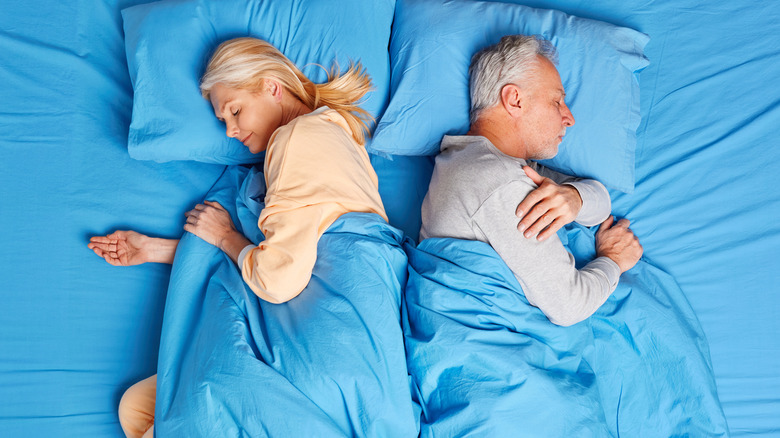 Couple with different blankets 