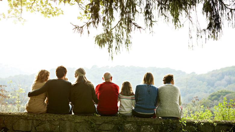 Multi-generational family sitting together