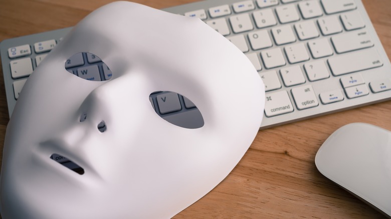 mask sitting on top of keyboard
