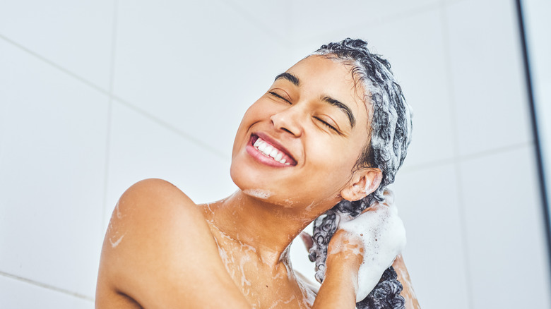 woman washing hair in shower