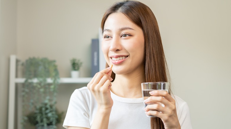 woman taking vitamins