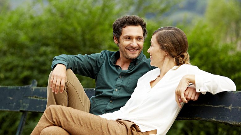 happy couple on bench