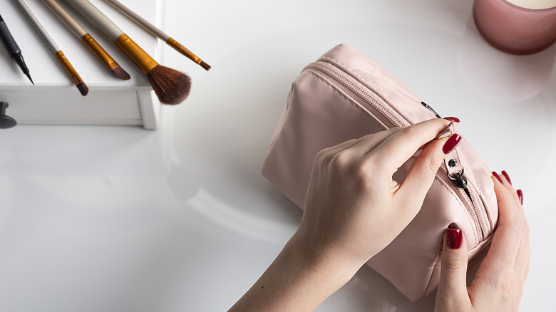 pink cosmetic bag and brushes