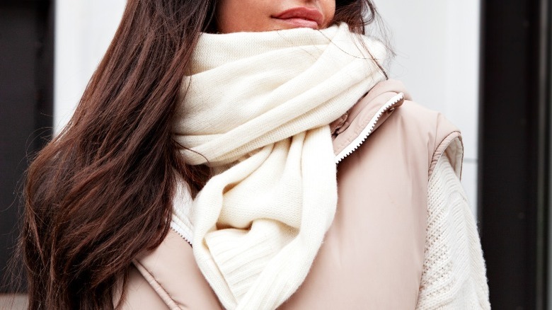 Women wearing puffer vest and scarf