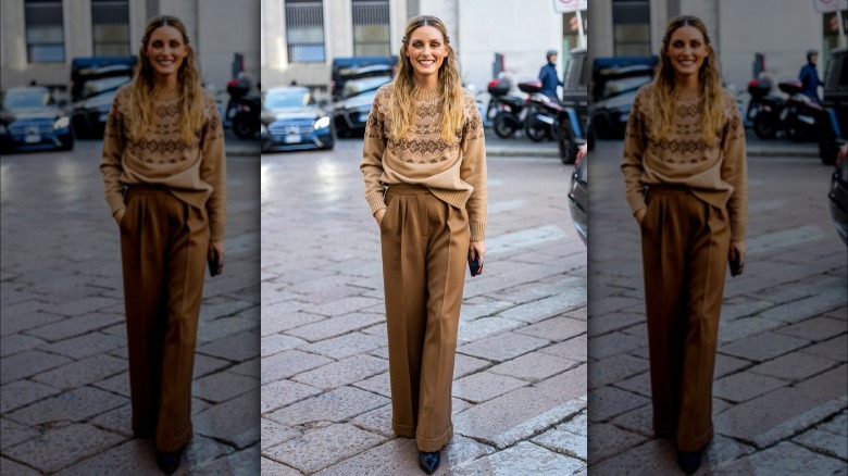 Olivia Palermo wearing brown sweater and trousers