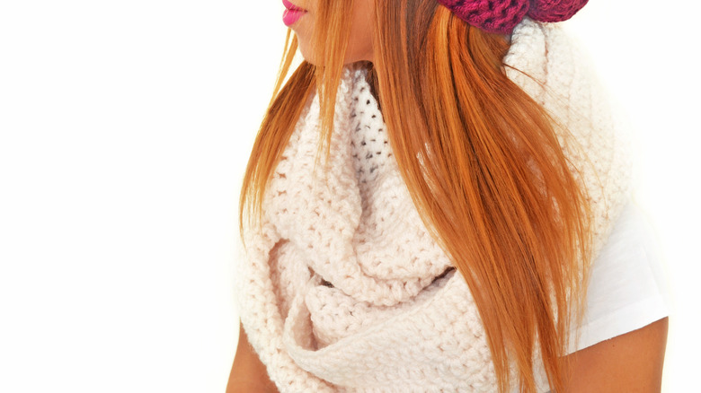 Woman with a white infinity scarf