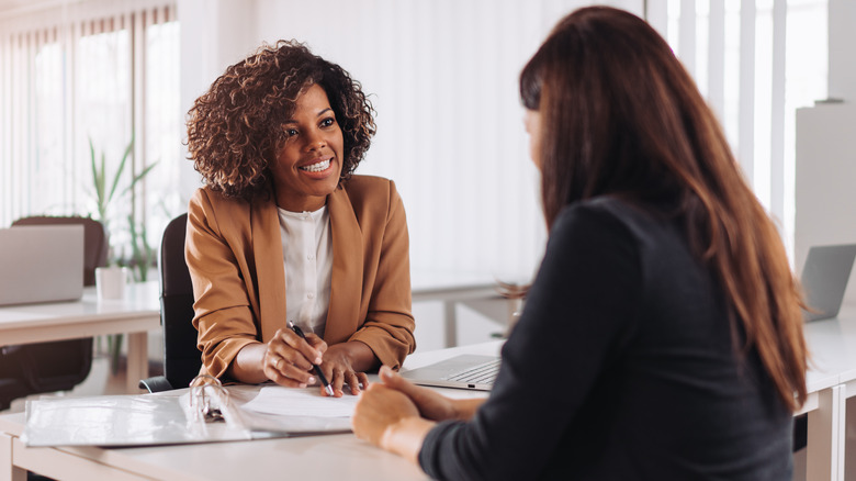 woman presenting proposal to boss