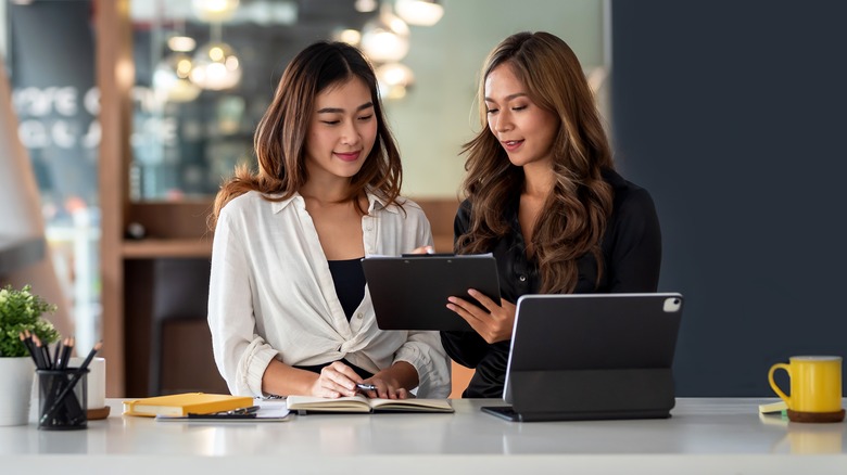 two women reviewing proposal