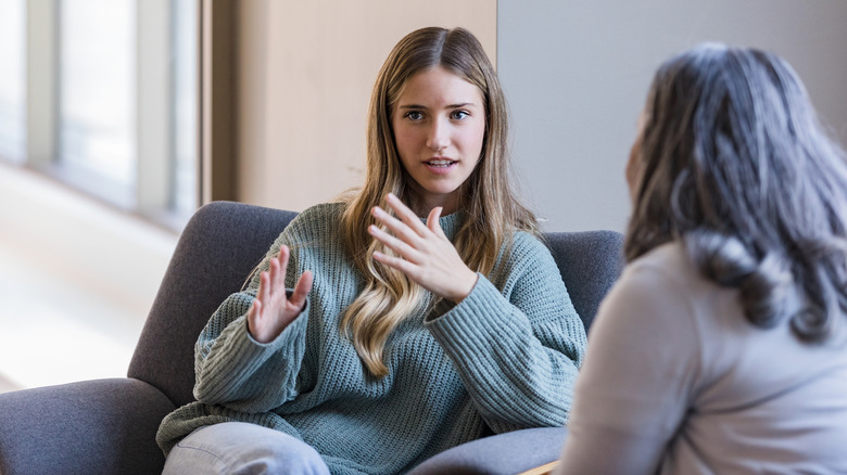 young woman talking to therapist