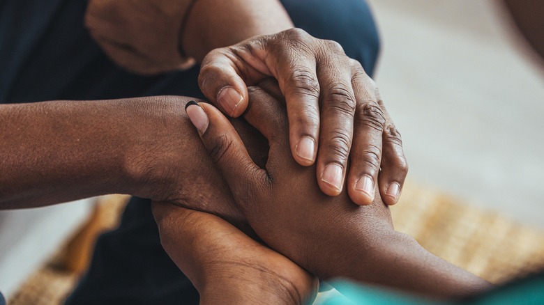 two people holding hands