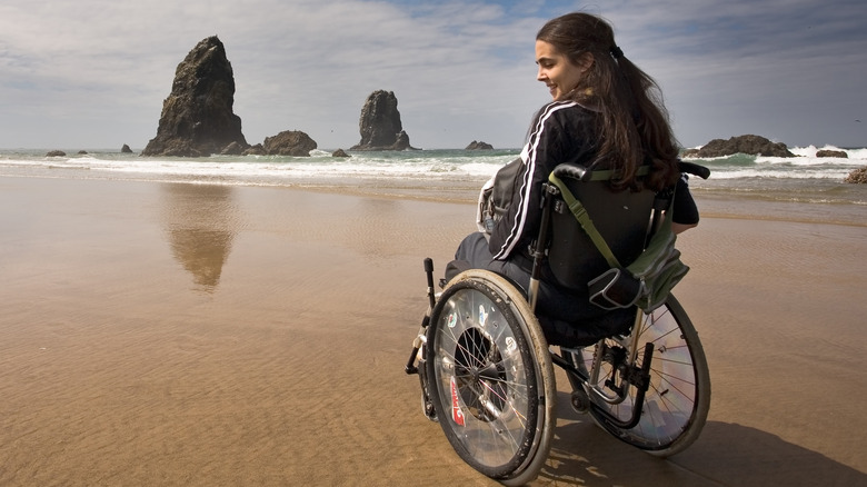 woman in wheelchair at beach