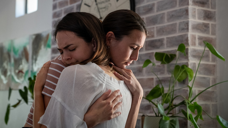 Two friends hugging