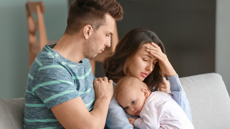 Man comforting upset woman