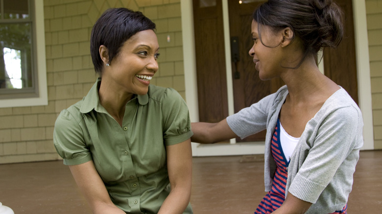 Two women talking outside