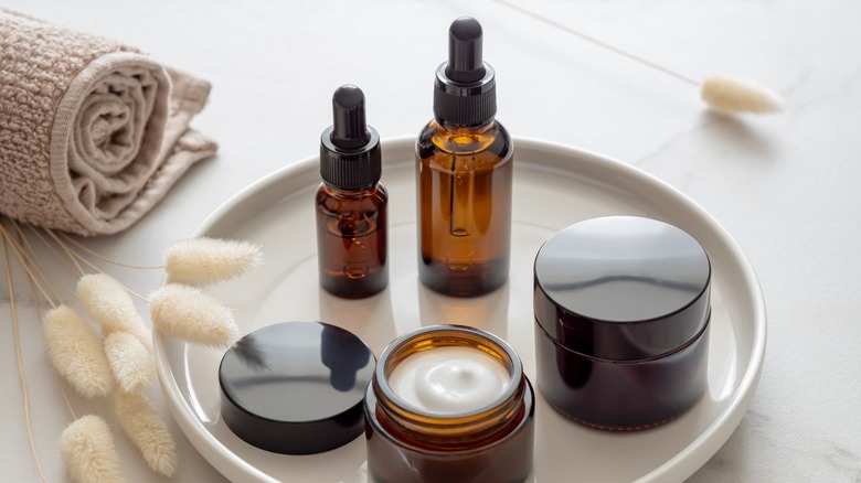 beauty products on round tray