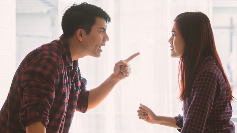 couple arguing, man pointing finger